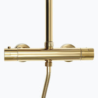 Colonne de douche dorée thermostatique